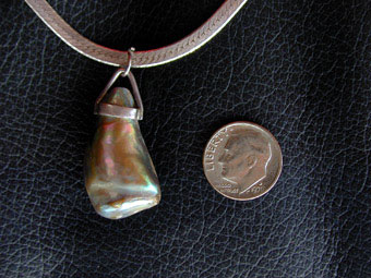 Unusually large jewely-grade abalone pearl made into a necklace