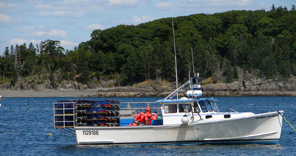 Lobster fishing boat loaded with traps and buoys