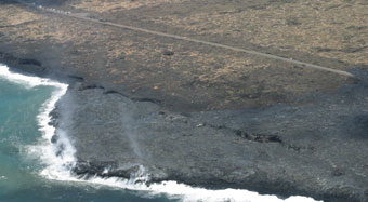 Helicopter view of lava over road and new shelf
