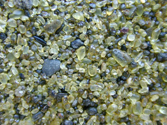 Closeup of Mahana Bay's green sand